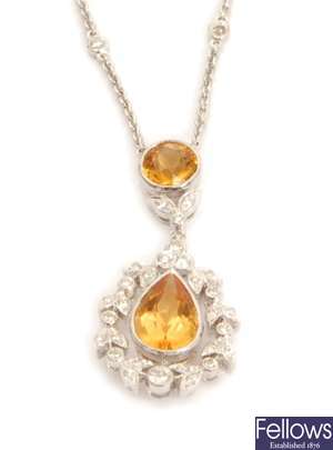 A citrine and diamond cluster pendant, with a