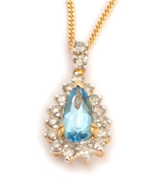 An 18ct gold blue topaz and diamond cluster
