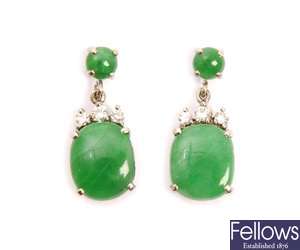A pair of Jade earrings comprising a circular