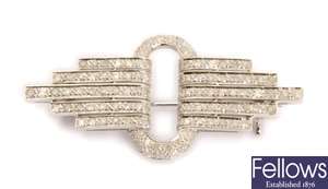 An Art Deco style diamond brooch, with a central