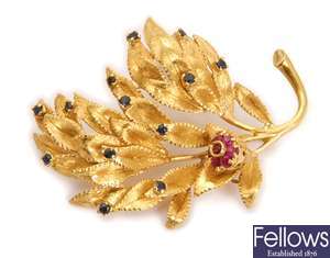An 18ct gold sapphire and ruby flower design