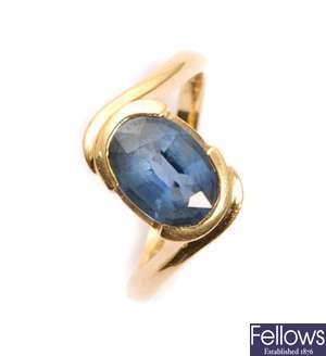 An 18ct gold single stone sapphire ring with an
