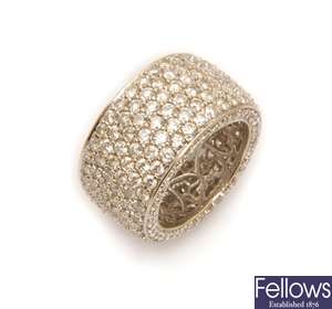 A wide round brilliant diamond set band ring, in