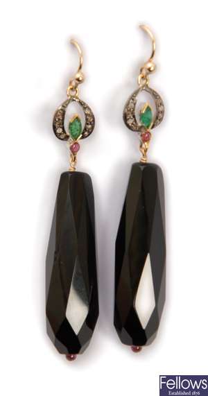 A pair of dropper earrings with a marquise cut