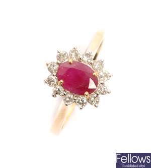 An 18ct gold ruby and diamond cluster ring with a