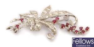 A ruby and diamond set floral design brooch, with