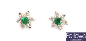 A pair of 18ct white gold emerald and diamond