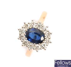An 18ct good, sapphire and diamond oval cluster