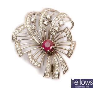 A modern ruby and diamond stylised flower brooch,
