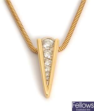 An 18ct gold chevron shape pendant set with six