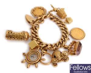 A 9ct gold lirb link charm bracelet set with ten