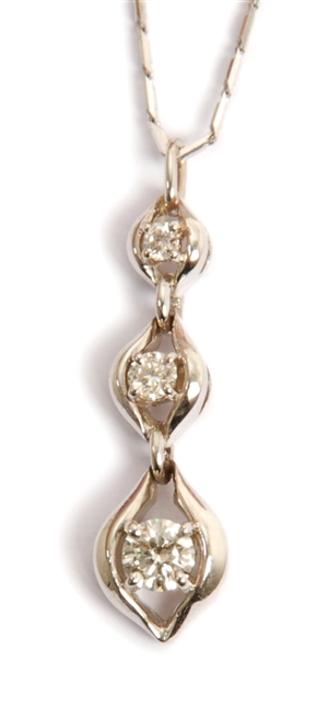 An 18ct white gold diamond set pendant, with