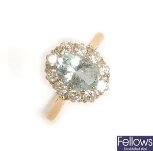 An 18ct gold aquamarine and diamond cluster ring,