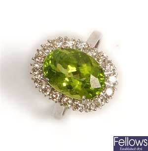 An 18ct white gold peridot and diamond cluster