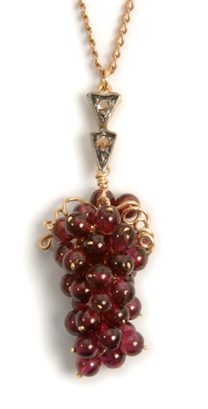 A diamond and garnet set grape design pendant,