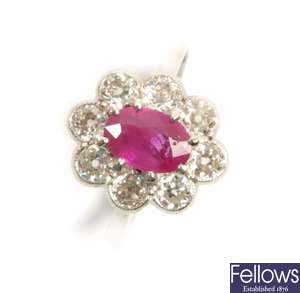 A ruby and diamond cluster ring, comprising a