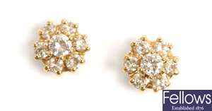 A pair of diamond set stud earrings, comprising a