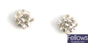 A pair of 18ct gold single stone diamond stud