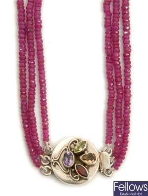 A stranded ruby necklet, comprising three