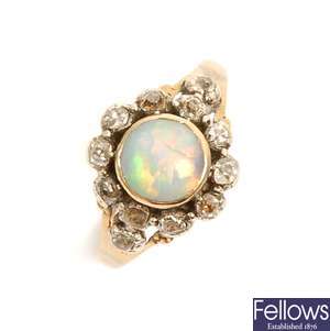An opal and diamond ring, comprising a central