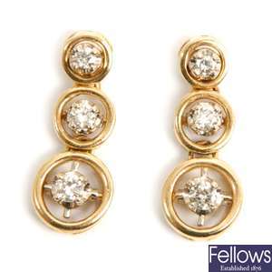 A pair of diamond set dropper earrings, with