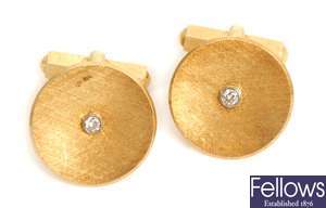 A pair of diamond set circular cuff links, with a