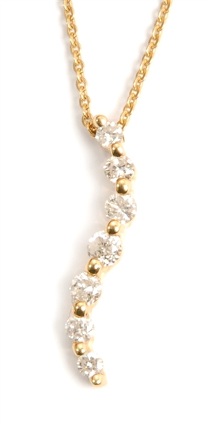 An 18ct gold diamond set necklet, comprising a