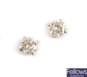 A pair of single stone round brilliant diamond
