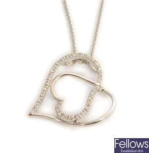 An 18ct white gold diamond set abstract heart
