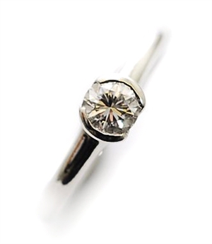 A platinum single stone diamond set ring,