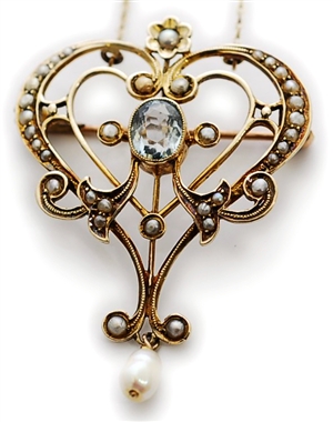 An Edwardian aquamarine and split pearl pendant,