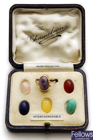 A boxed cabochon fluorite set ring, with five