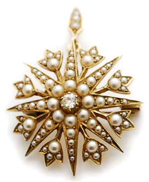 An Edwardian diamond and split pearl set star
