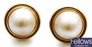 A pair of mabe pearl stud earrings, each