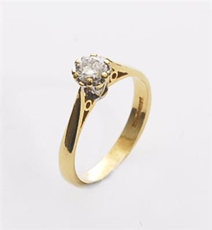 An 18ct gold single stone diamond ring in a claw