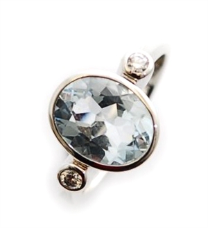 A three stone aquamarine and diamond ring,
