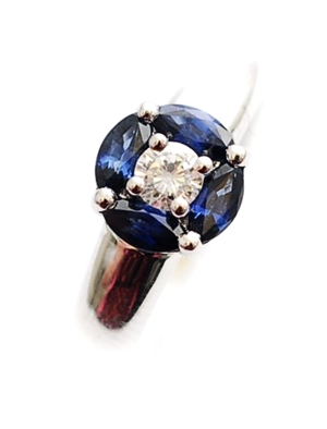 An 18ct white gold sapphire and diamond cluster