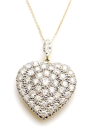 A diamond set heart shape pendant, pave set with