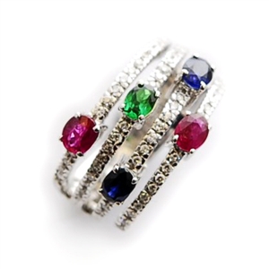 A multi gem set band ring, in a round brilliant