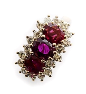 An 18ct white gold ruby and diamond cluster ring,