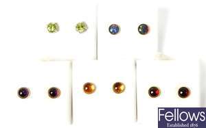 Four pairs of cabochon cut stone set stud