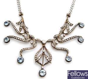 An ornate aquamarine and diamond necklace,
