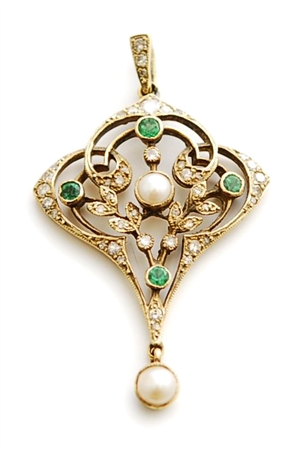 A mid 20th century split pearl, emerald and