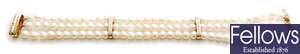 A 14ct gold three row cultured pearl bracelet,