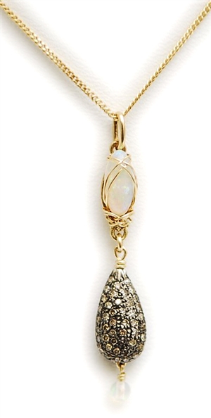 A 9ct gold opal and diamond set pendant,