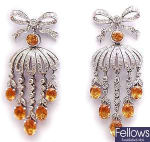 A pair of ornate diamond and imperial topaz