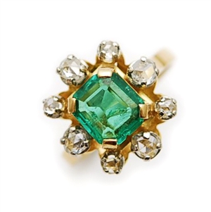 An emerald and diamond ring, comprising a