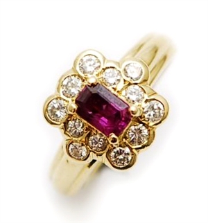 An 18ct gold ruby and diamond set cluster ring,