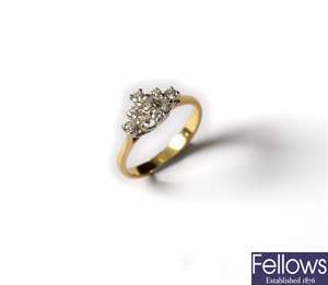 An 18ct gold diamond cluster ring, the diamonds
