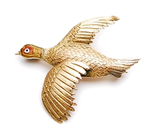 A grouse design stick pin depicting the bird in